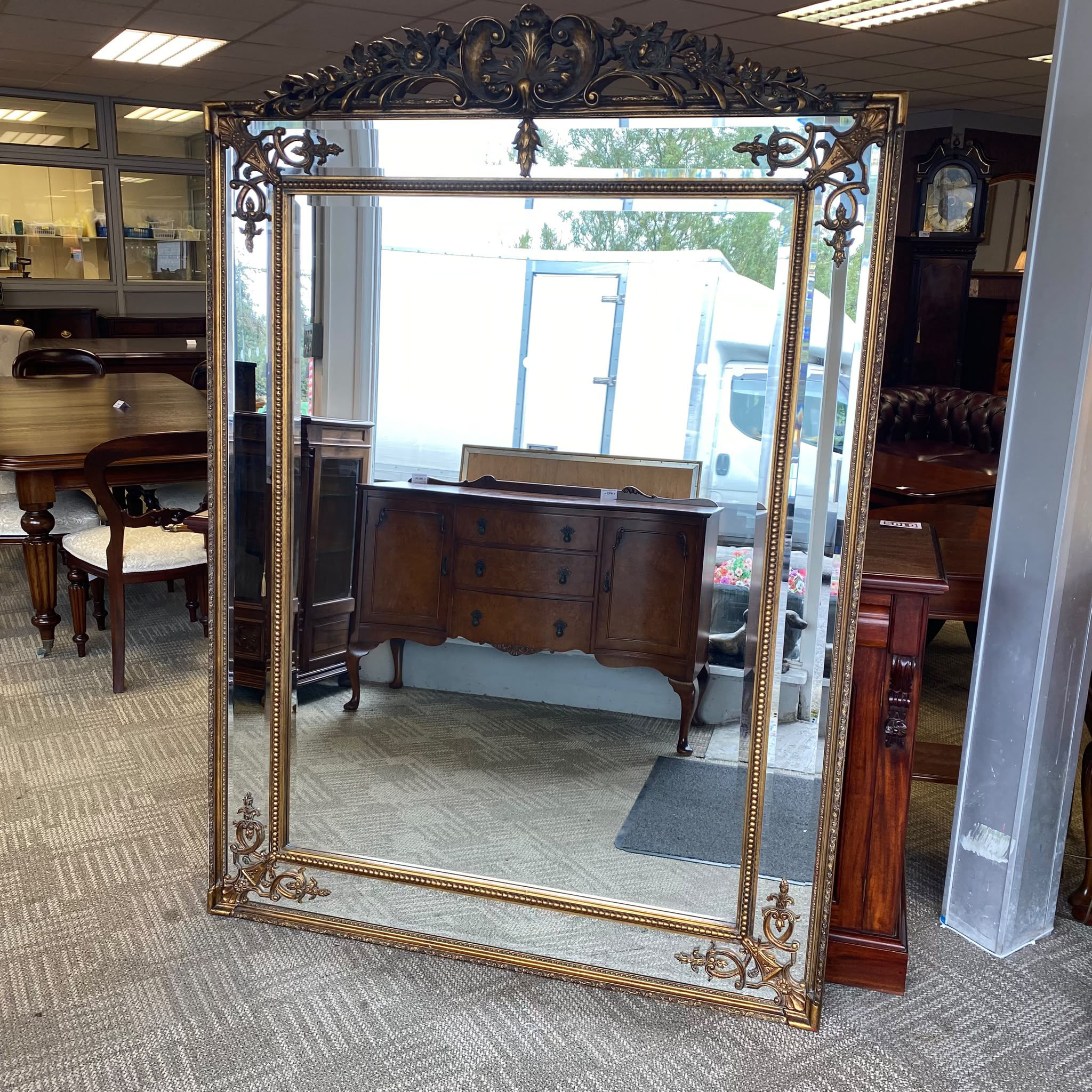 Impressive large decorative mirror with a richly detailed antique-style gilt fra