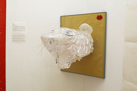 A tiger head made from recycled takeaway plastic