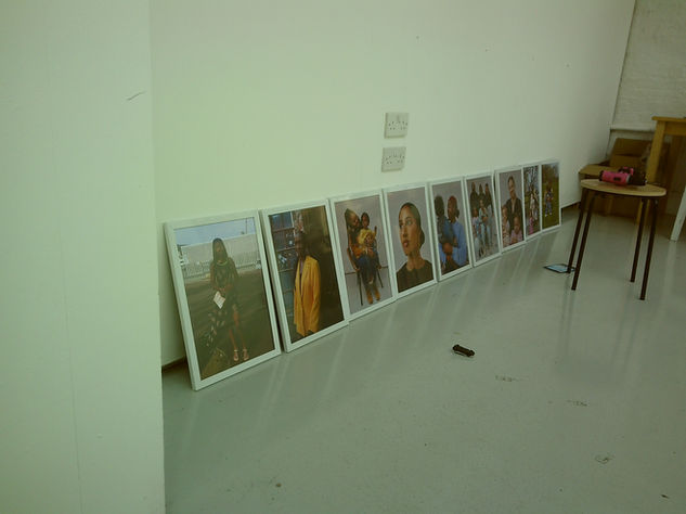 PVC frames sit in a line along a wall in the exhibition space.