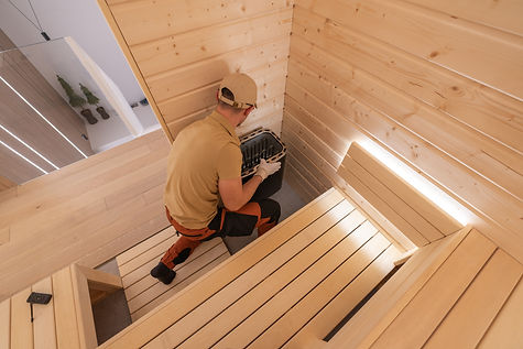 builder-his-40s-finishing-residential-finnish-sauna.jpg
