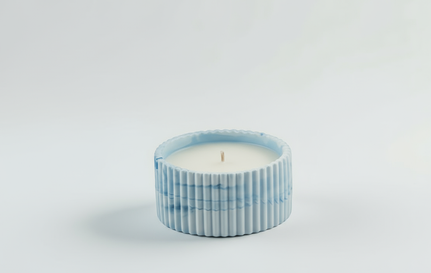 Fleur Blanche Candle side view in textured blue resin jar, handmade by Andle with jasmine fragrance