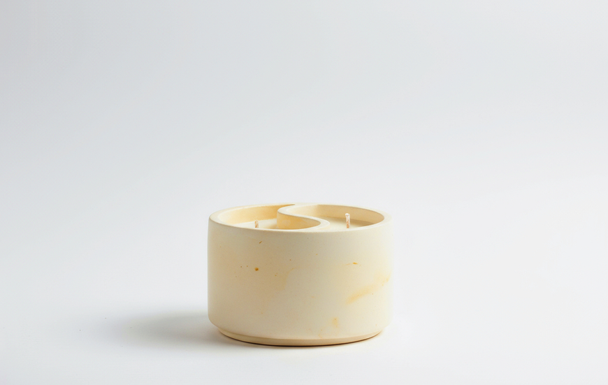 Dual Bloom Candle by Andle, yellow resin candle showcasing dual-scent sides with floral and fresh notes.