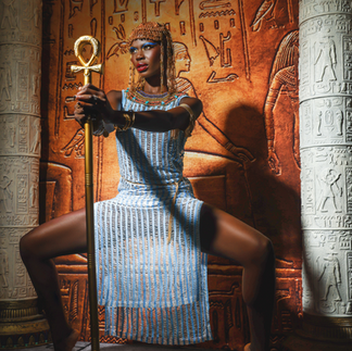 Custom Egyptian photography set in LA studio featuring throne, columns, and props