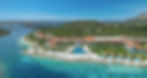 Aerial view of a coastal resort with terracotta-roofed buildings, pools, and palm trees. Blue sea and green hills in the background. Text: Sandals. Sandals Royal Curacao