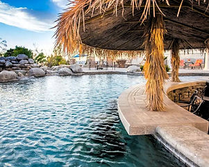 1c - Le grand Bleu - Tropical Outdoor Pool w_ Swimup Bar and Palapa.jpg