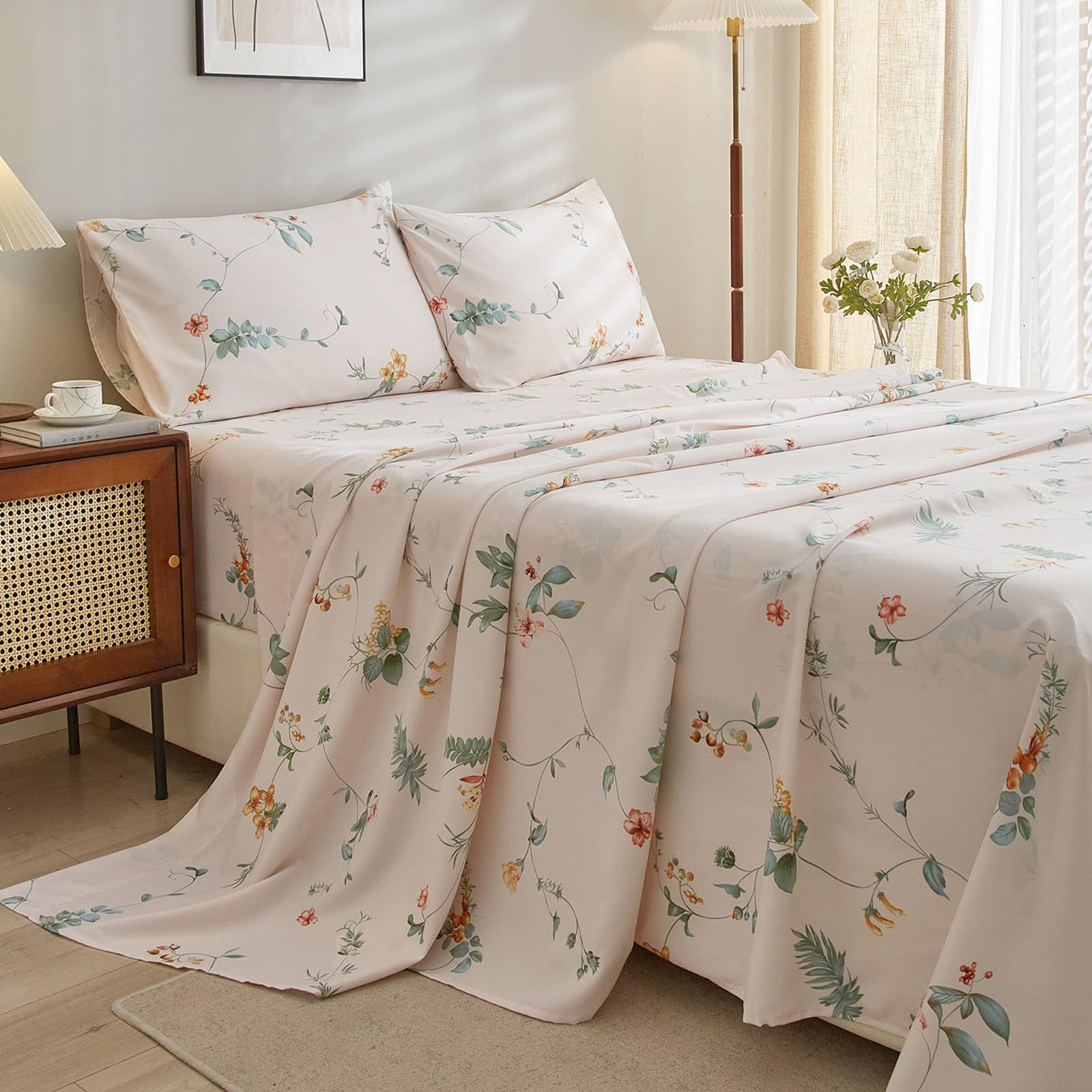 Floral pattern bed sheets and pillowcases on a made bed