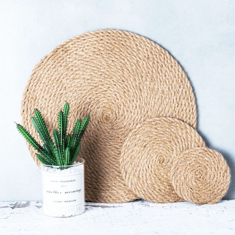 Thumbnail: Three round woven jute trivets and a small potted cactus
