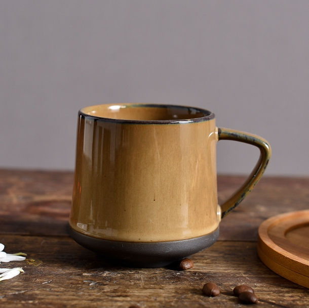 Thumbnail: Earth-toned ceramic coffee mug on a rustic wooden table.