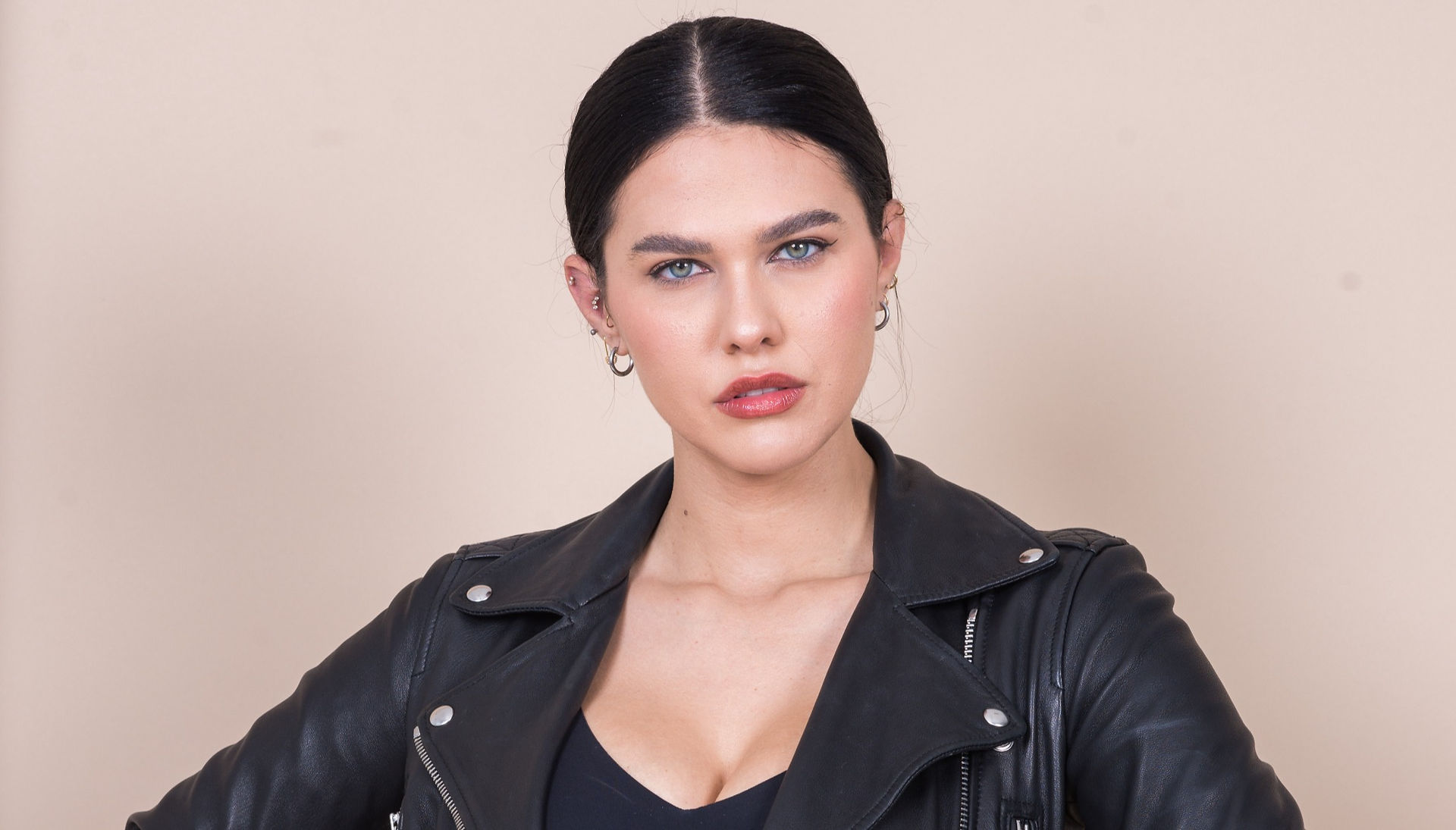 Commercial headshot for female actress in a leather jacket