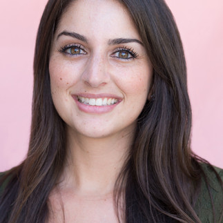model woman smiles for her business headshot photoshoot