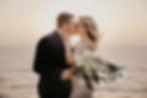 Bride and Groom kiss at their destination wedding elopement at the beach