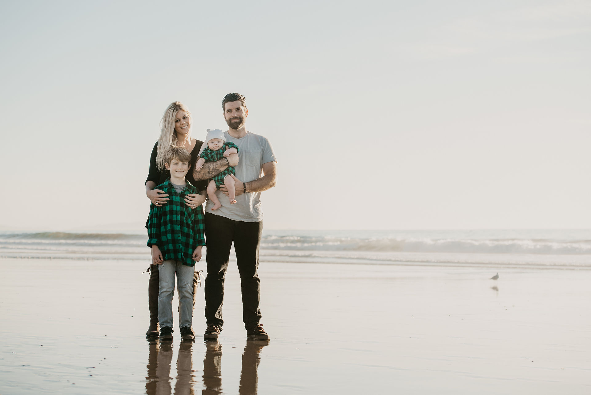 Family portrait photoshoot at the beach