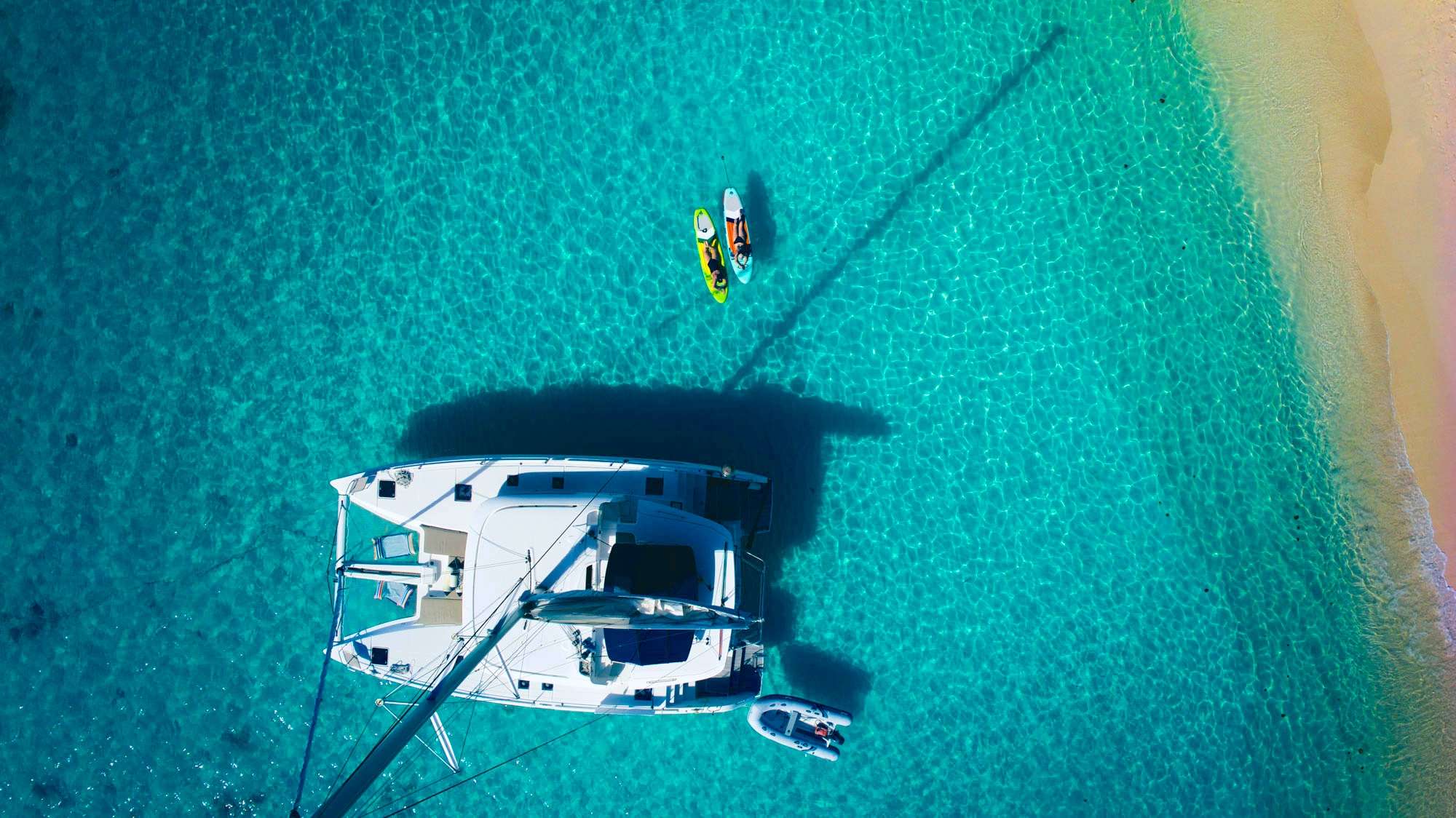 Anchored off the beach with the paddleboards out