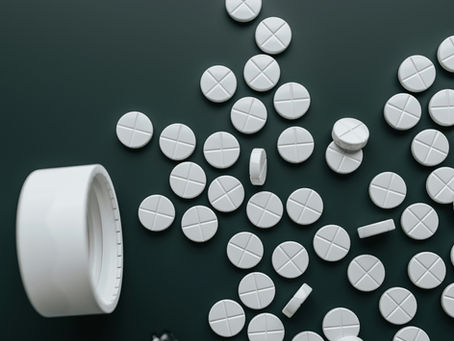 white pills on dark background