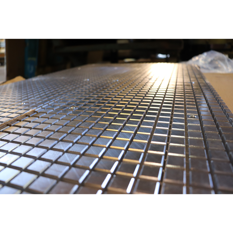 Close up view showcasing the grid style top plate on a MAV Series Rectangular vacuum chuck