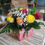Thumbnail: Round bouquet of roses in colorful tones