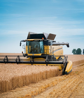 great-combine-harvester-working-field-agricultural-machine-blue-sky.jpg