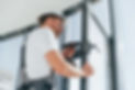 grey-uniform-repairman-is-working-indoors-modern-room (1).jpg