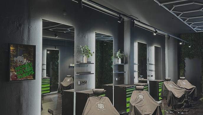 a room with chairs and tables with black covers