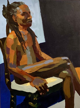 Homme nu de couleur assis sur une chaise
