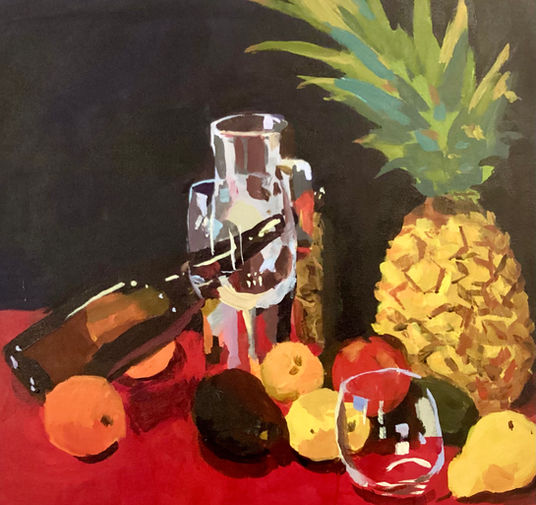 Verre, bouteille et ananas  sur nappe rouge