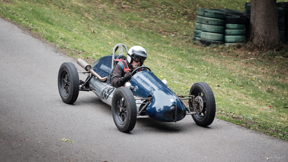 Classic car racing up hill at Prescott
