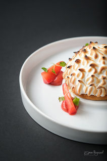 Strawberry Meringue with cut strawberries on the side