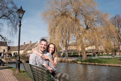 A couple sat on a bench together