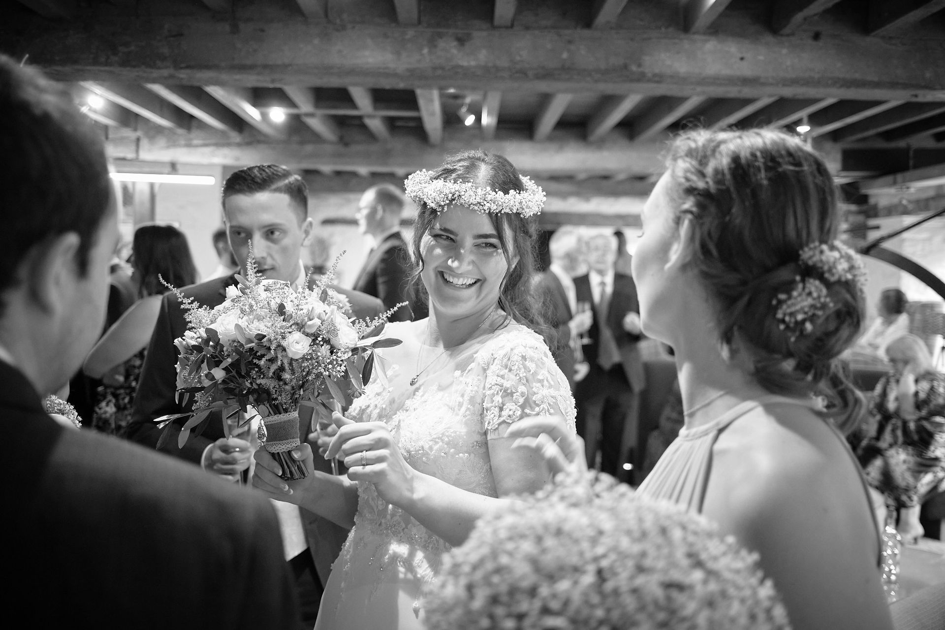 Bride laughing with friends 