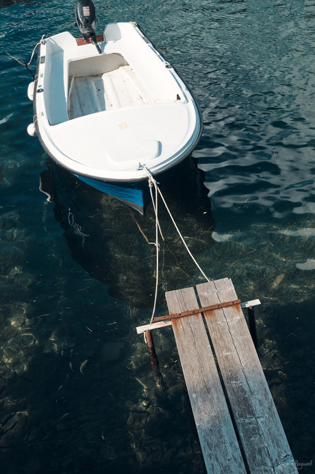 Boat moored to a small jetty