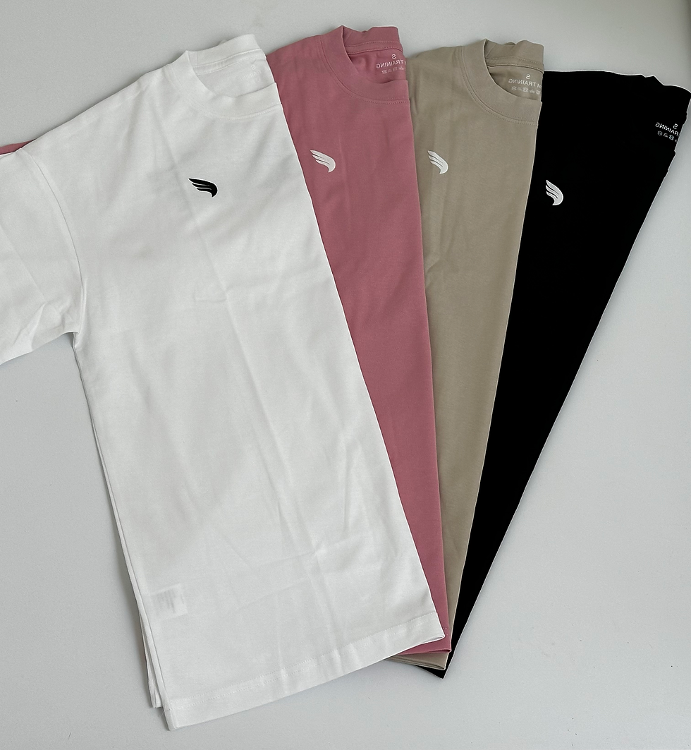 Thumbnail: Inspire T-Shirts opgevouwen – kleuren wit, zwart, roze en beige