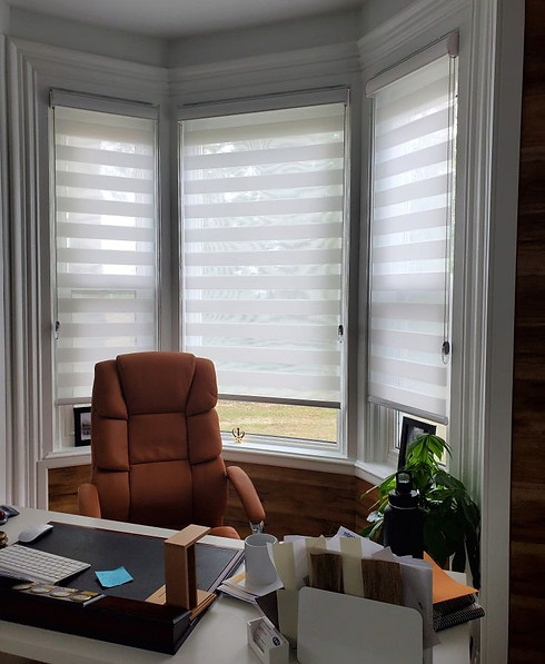 white room darkening day n night blinds on a bay window at a home office