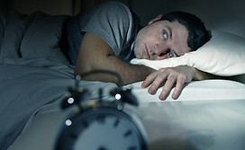 Man In Bed With Eyes Opened Suffering Insomnia And Sleep Disorder.jpg