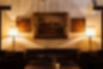 This is the grand staircase room with couch and horse