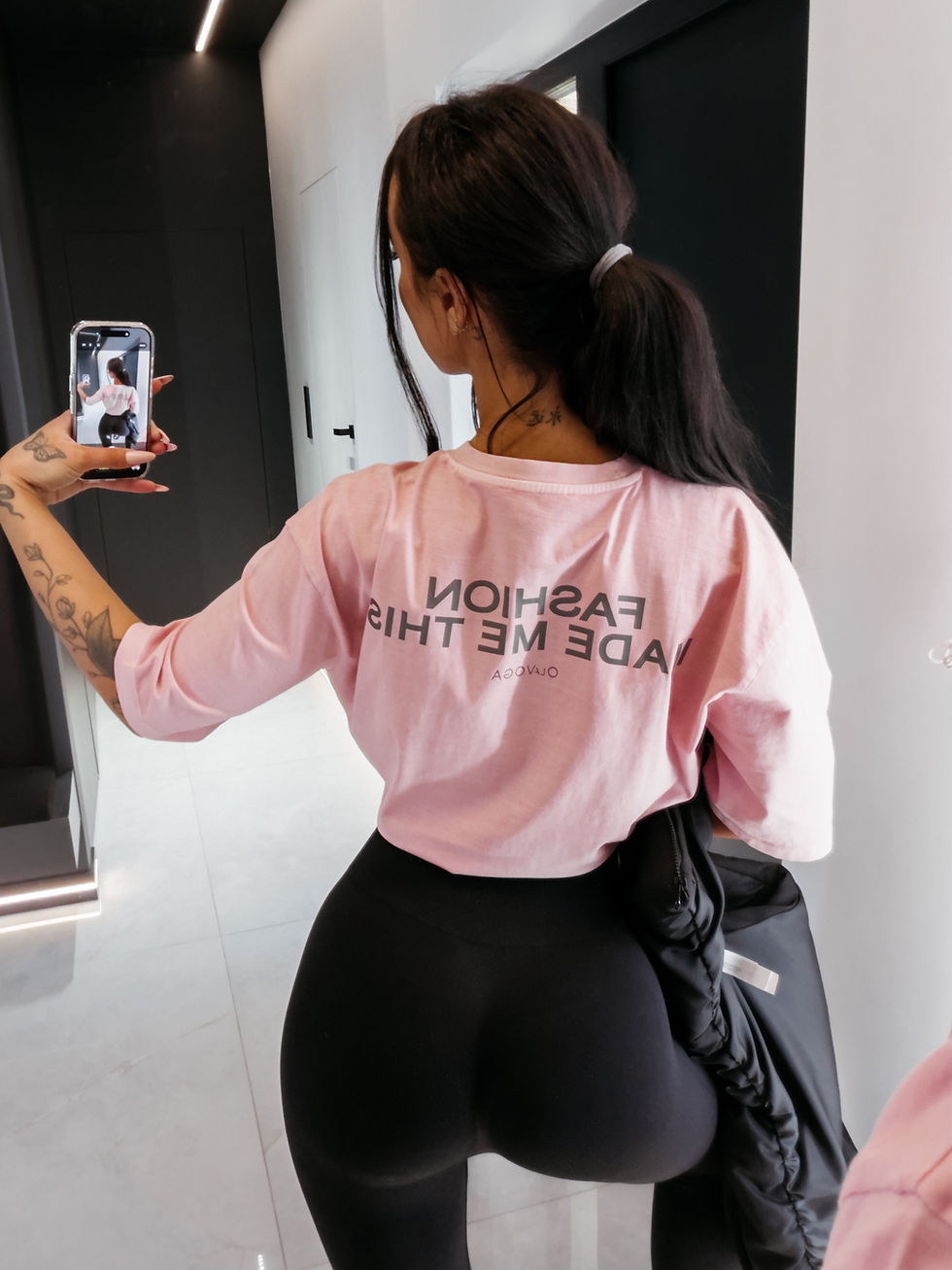 ENORAI 2026 Ola Voga pink t-shirt – model back, "Fashion Made Me This" print on the back, premium streetwear style