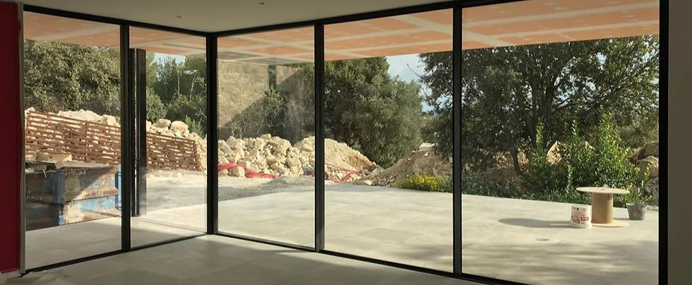 Cortizo black frame windows onto sunny patio