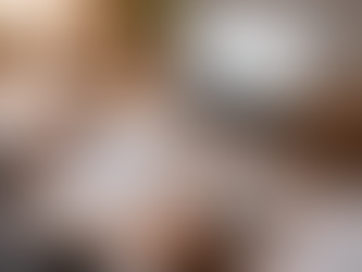 Small business owner reviewing financial reports at a desk with a laptop dashboard, calculator, clipboard, and charts showing decision-ready bookkeeping in action.