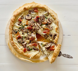 Whole wheat pizza with mixed mushrooms, prosciutto and bleu d’Auvergne