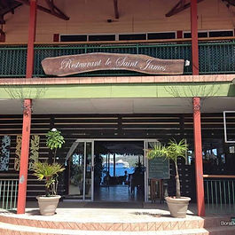 The restaurant's entrance is clearly visible at the forefront of a modern building.