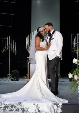 bride and groom posing and smiling