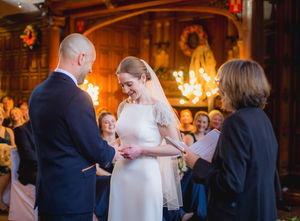 Jesmond Dene House wedding, Newcastle Upon Tyne. a bride and groom smile during their wedding ceremony
