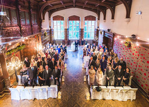Jesmond Dene House wedding, Newcastle Upon Tyne. a large group of people standing in a large room