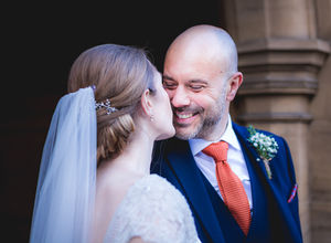 Jesmond Dene House wedding, Newcastle Upon Tyne. a bride and groom kissing with the bride wearing a veil