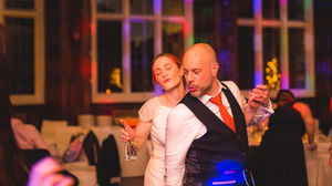 Jesmond Dene House wedding, Newcastle Upon Tyne. a bride and groom are dancing at a wedding reception