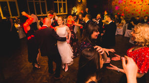 Jesmond Dene House wedding, Newcastle Upon Tyne. a bride and groom are dancing at a wedding reception