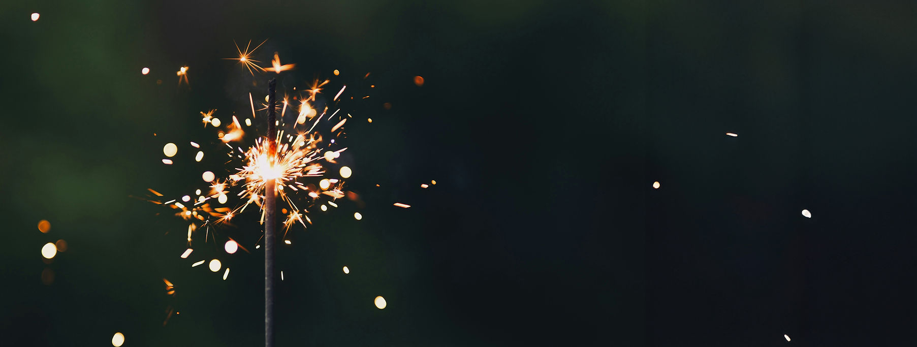 A glowing sparkler, symbolizing the spark of innovation and energy BrightSpark brings to LMS/LXP project management support, helping organizations achieve their learning goals.