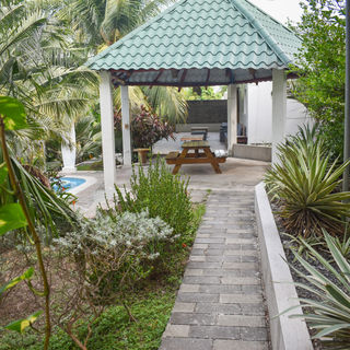 Private pool and terrace area of Atami house overlooking tropical hills