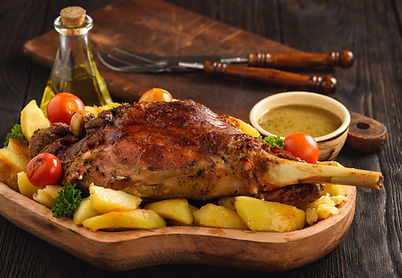 Slow baked lamb leg with potatoes and sa