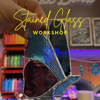 Hand holding beautiful stained glass butterfly. Stained Glass WORKSHOP text.