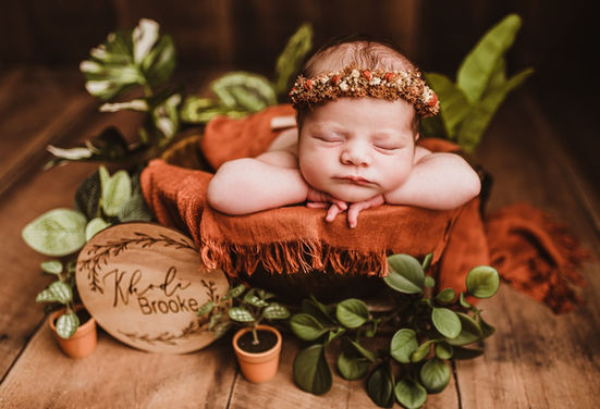 Beautiful posed newborn portrait with floral crown by Baltimore newborn photographer Tasha Sojka